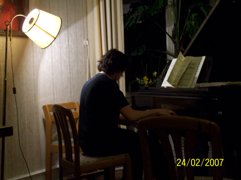 Yurii Khomskii playing piano